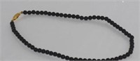 Black coral bead necklace
