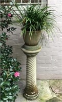 Pair of concrete plant stands with plants