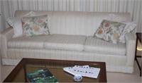 Three seater lounge and two arm chairs