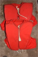 2 old life jackets