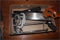 tray of clamps; saw; square
