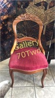 Antique wood carved chair with tufted seat