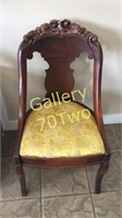 Antique carved cherry wood accent chair with