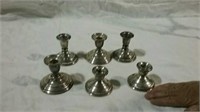 6 candle holders all marked Sterling