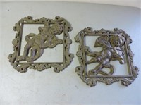 Pair of cast iron wall hangings