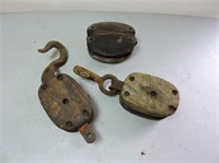 2 - small wood pulleys & hooks & one caseing