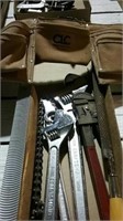 Leather tool belt,  pipe wrench, adjustable wrench
