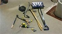 Snow shovel, axe and assorted garden tools