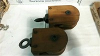 2 old wood pulleys