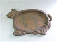 Old cast skillet shaped like cow