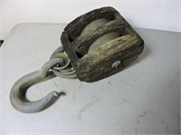 Large antique wood pulley with hook