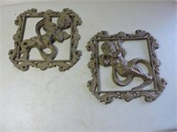 Pair of cast iron wall hangings