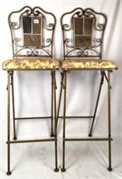 Pair of folding metal frame chairs with cushions
