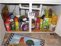 Assorted cleaning supplies under sink