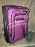 Very nice Delsey rolling suitcase - purple