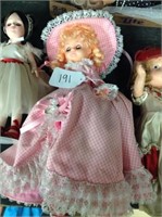 Doll with pink bonnet and long dress