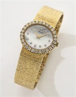 Piaget 18K gold and diamond watch having a mother