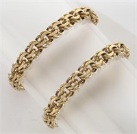 (2) 14K yellow gold charm bracelets.