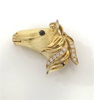 18K gold, diamond and onyx horse's head clip.