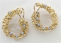 Pair 18K gold and diamond earrings.