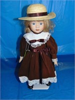 Porcelain Doll With Straw Hat