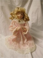 vintage 1990s girl in prayer doll