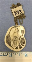 A very nice scrimmed 1 1/2" ivory pendant, of a ma
