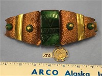 A copper and brass and jade bracelet, with holy me