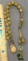 22" green stone bead necklace, with a jade Infant