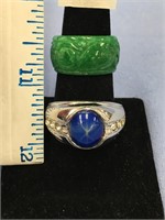 Lot of 2 rings, one men's silver tone with blue st