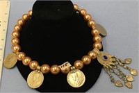 Approx. 19" long necklace of gold tone faux pearls