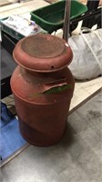 Painted red metal large milk can with lid