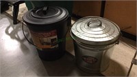 Two metal trash cans, both like new and one with a