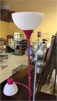 Two floor lamps, one bright pink and one silver