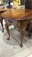 Oval top side table with Queen Anne style legs and