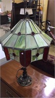 Antique table lamp with green and red stained