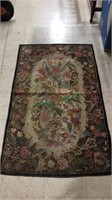 Antique floral rug with wrapped edge and some