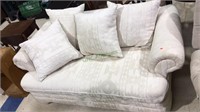 Off white sofa with four detachable pillows for