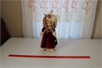 Doll with Curls in Red Velvet Dress