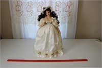 Doll in White Wedding Dress on Metal Stand
