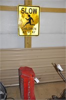 SLOW CHILDREN AT PLAY SIGN AND PLASTIC MOTRO