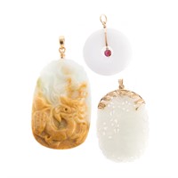 A Trio of Hand Carved Jade Pendants