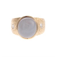 A Star Sapphire Ring in 18K Yellow Gold