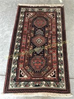 TRIBAL CARPET WITH THREE CENTRAL MEDALLIONS