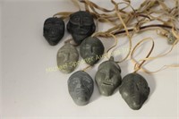 SEVEN INUIT STONE FACE MASK PENDANTS -SOME SIGNED
