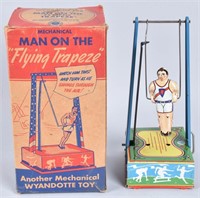 WYANDOTTE Tin Windup MAN ON TRAPEZE w/ BOX