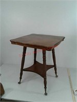 Antique oak parlor table with glass ball feet