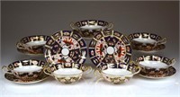 Eight Royal Crown Derby Imari cream soups & stands