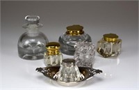 Six small inkwells with brass and glass