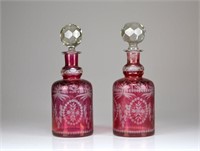 Two cranberry flashed glass decanters
